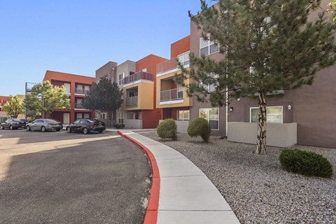 A modern building with a red and white curb in front.