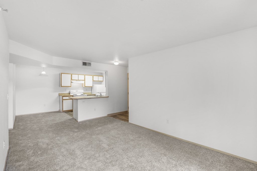 A room with a desk and a window.