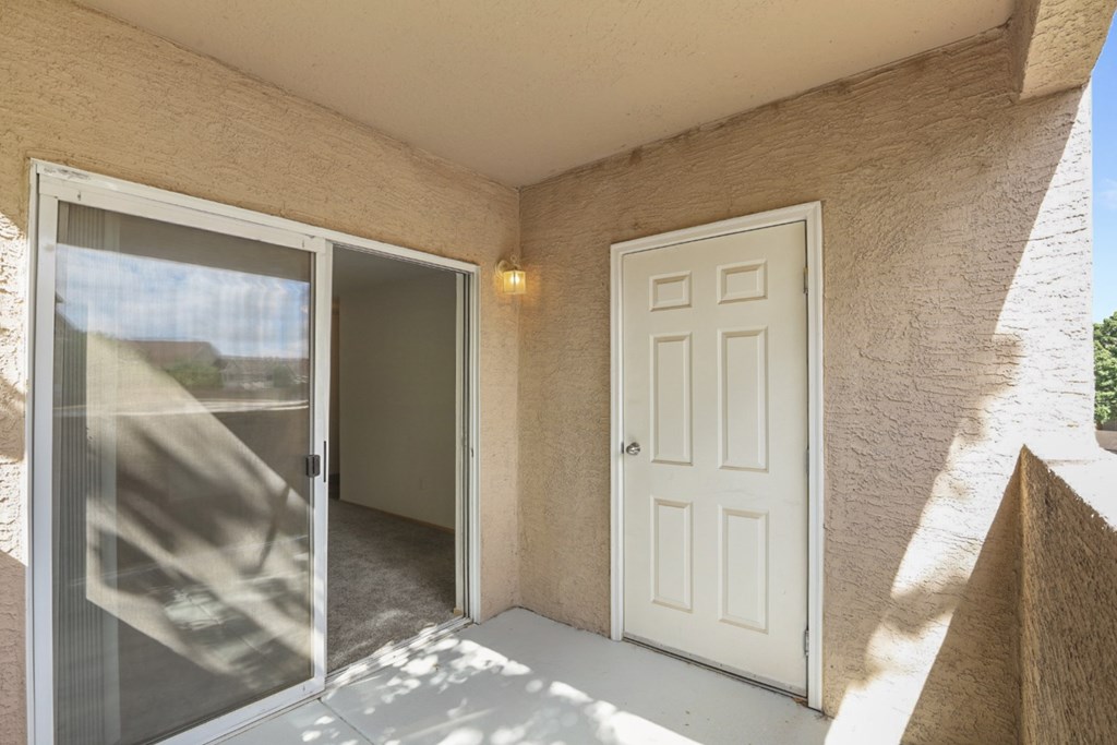 A white door is on the right and a glass door is on the left.