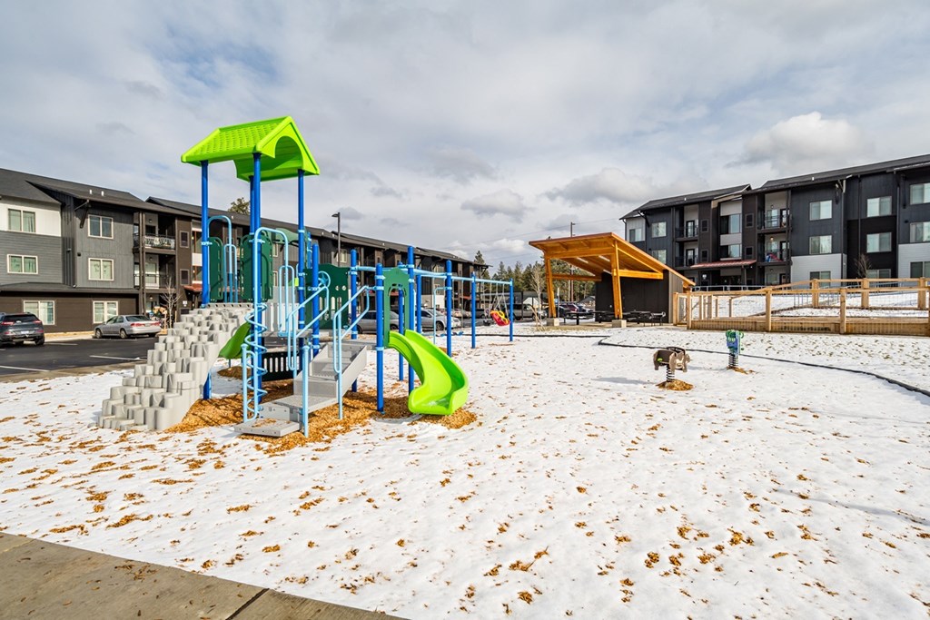 the playground at the flats at big tex apartments
