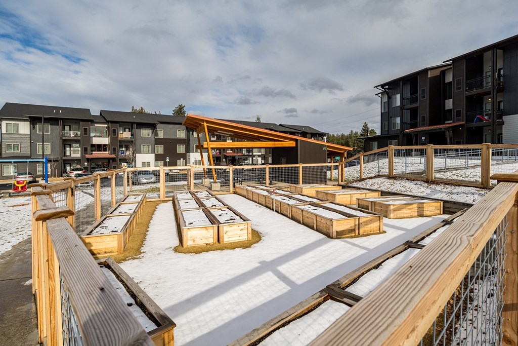 a construction site with wooden benches in the snow