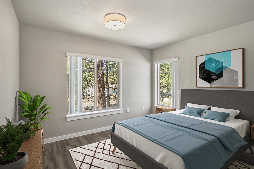 a bedroom with a bed and two windows