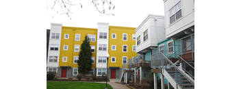 a group of buildings with different colors on them