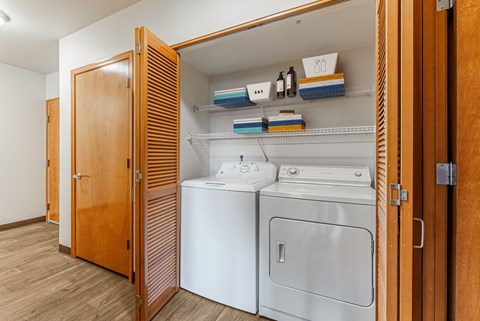 A laundry room with a washer and dryer.
