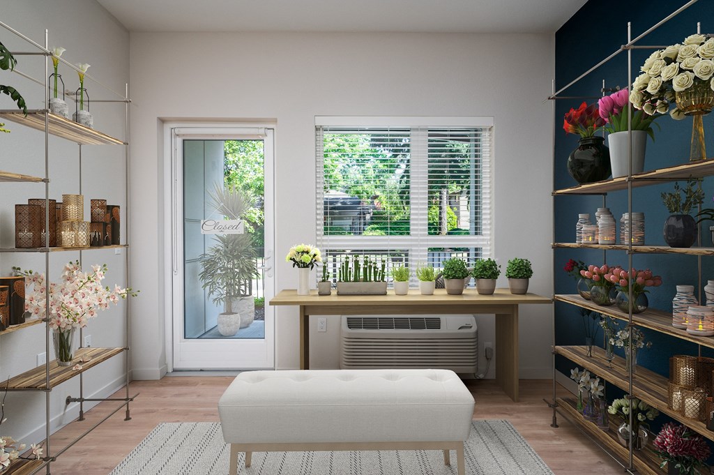 a living room with a table and plants and a window