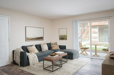 a living room with a blue couch and a coffee table