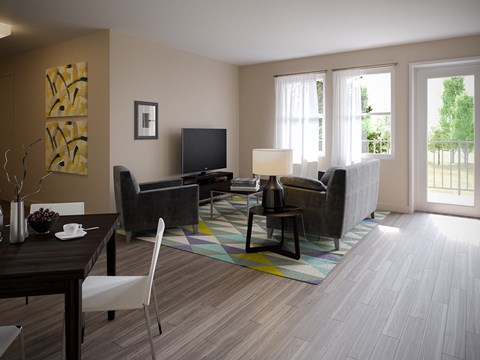 A living room with a couch, chair, and television.