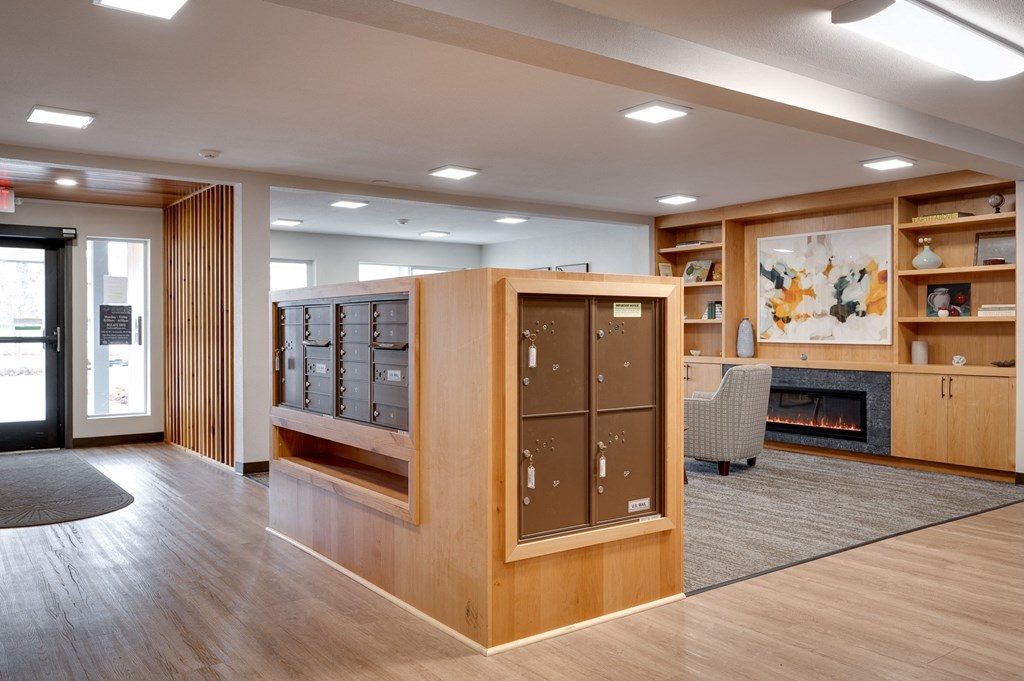 a large room with a fireplace and wooden furniture