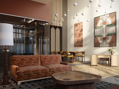 A living room with a brown sofa and a coffee table.