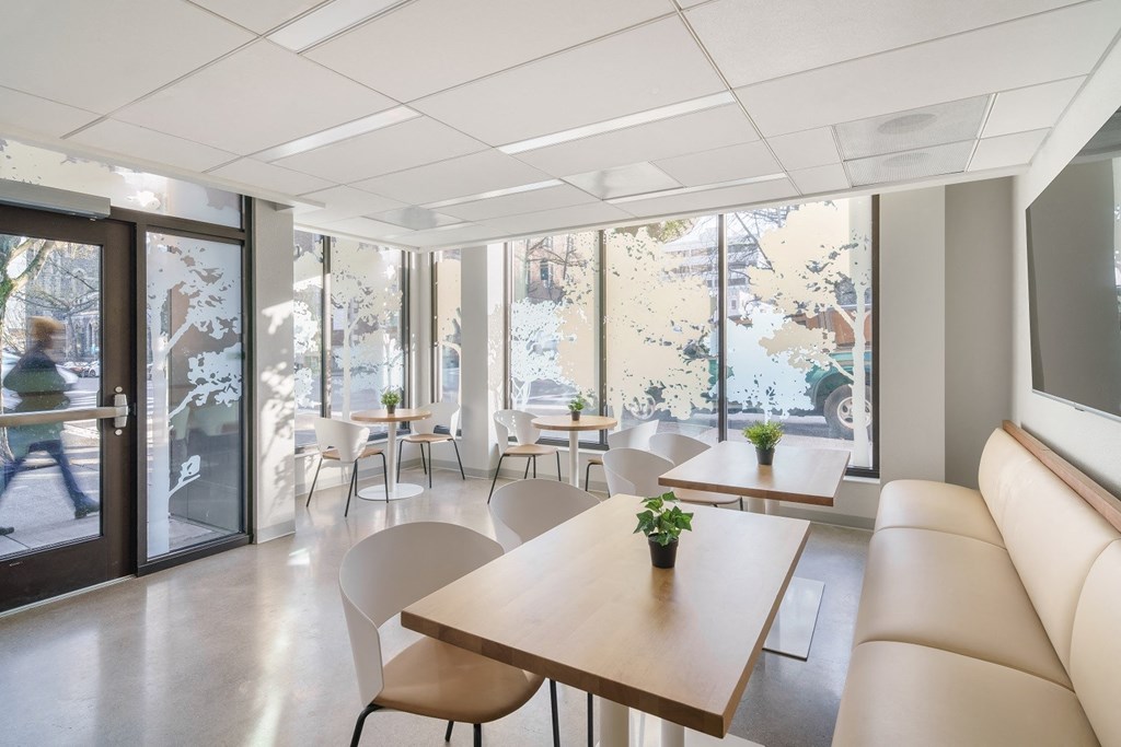 a room filled with furniture and a large window