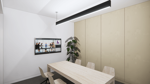 a dining room with a table and a tv on the wall