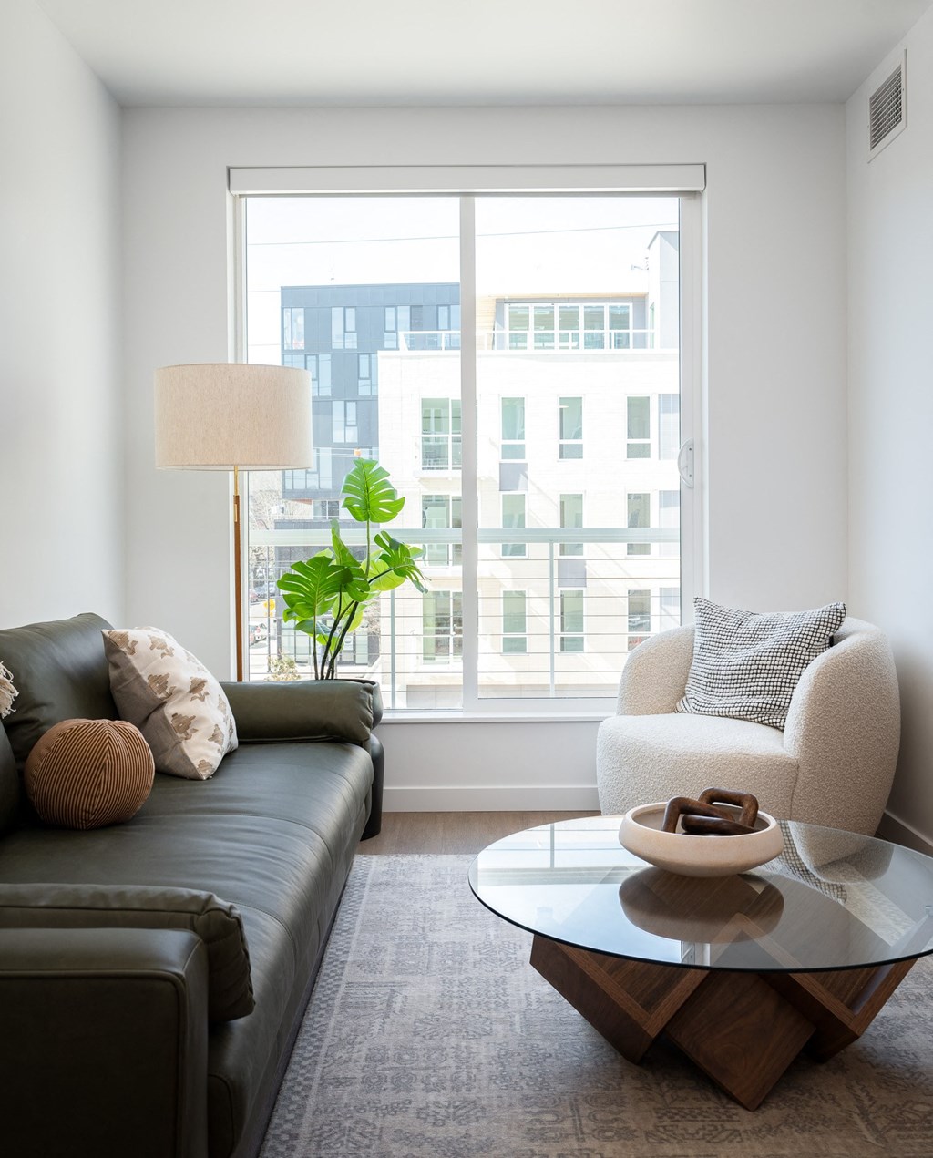 living room with a large window and a couch and a coffee table at Slabtown Square Apartments, Portland ,Oregon, 97209