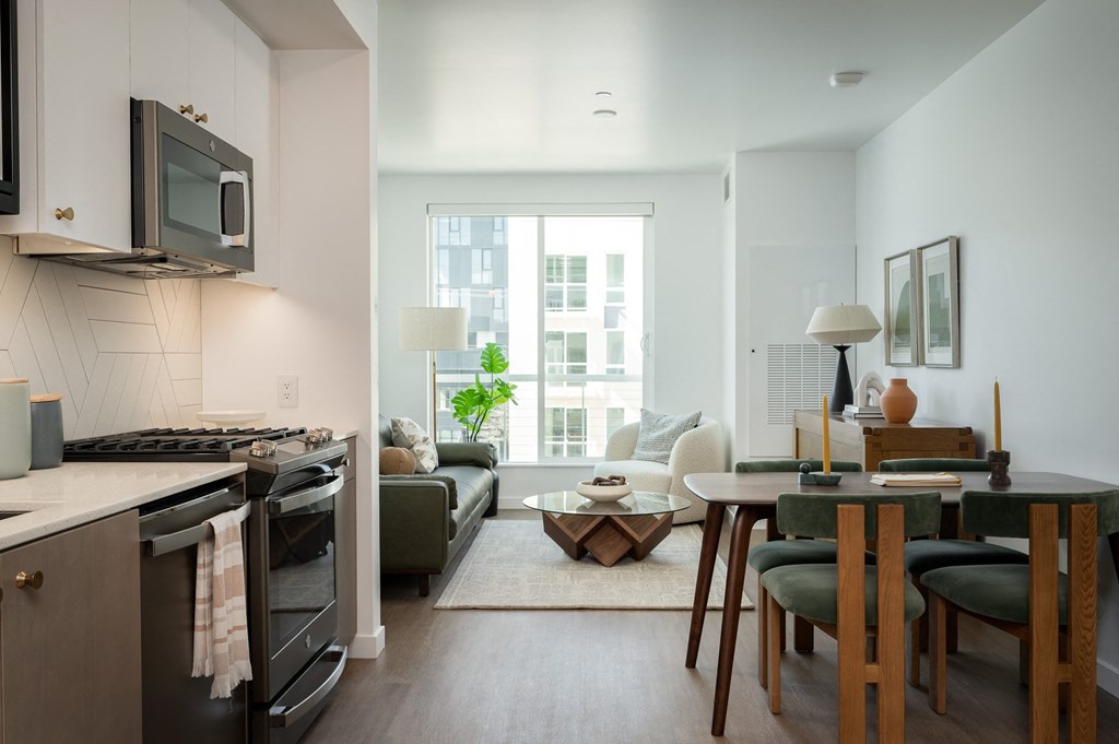 a living room with a kitchen and a dining room