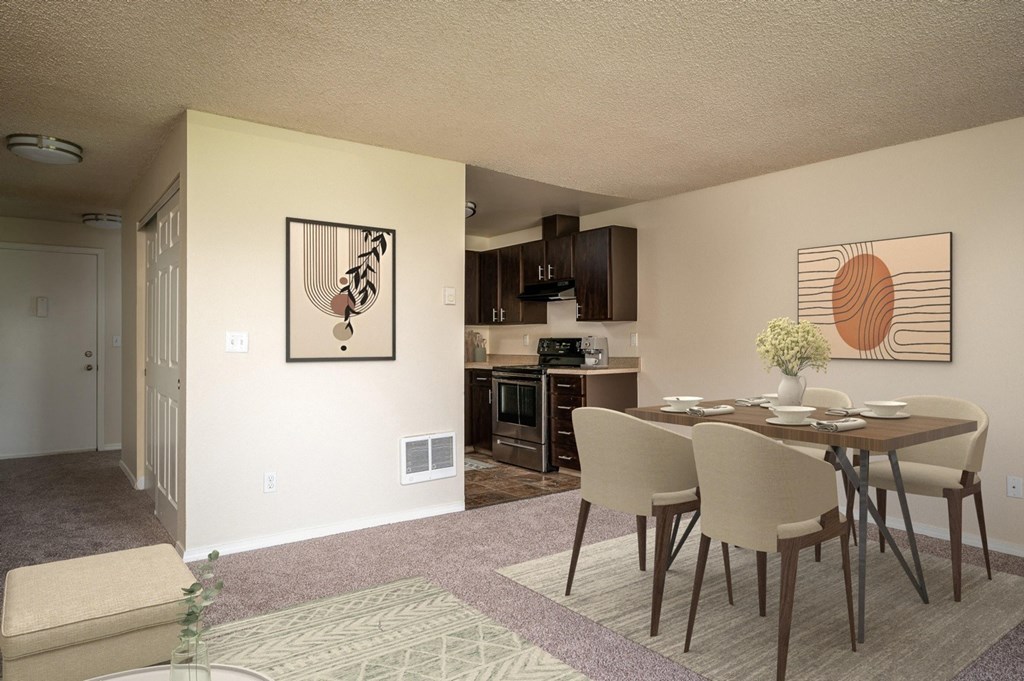 an open living room and dining room with a table and chairs