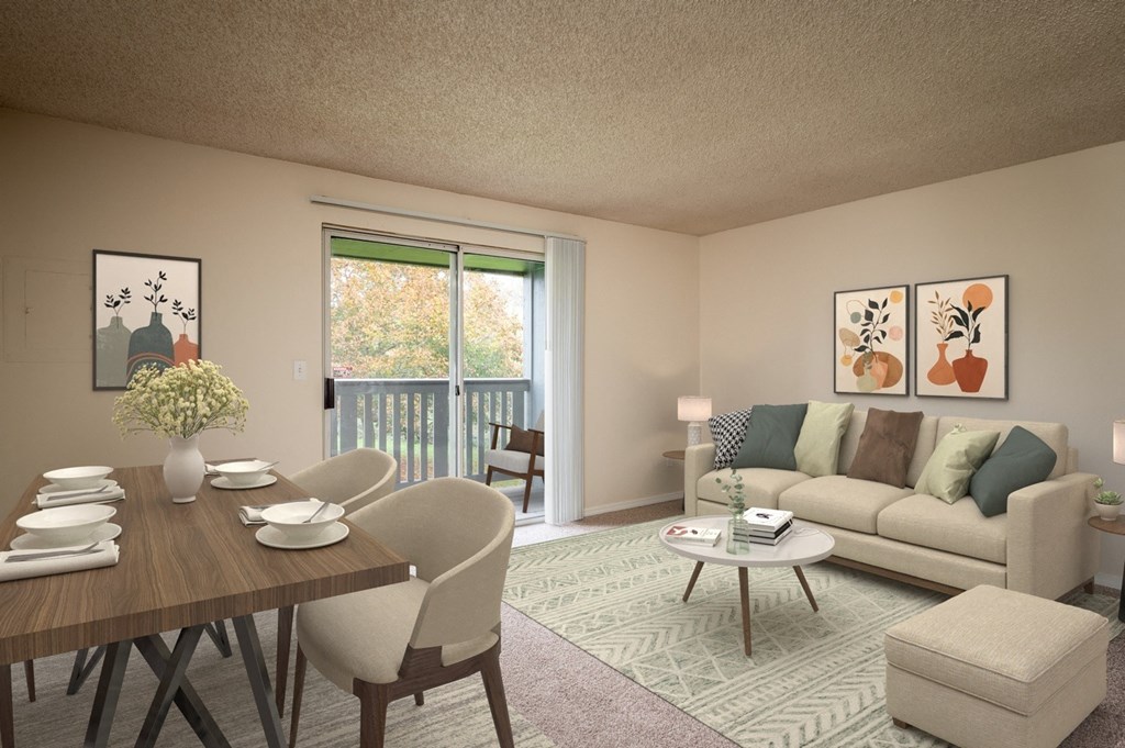 a living room and dining room with a couch and a table