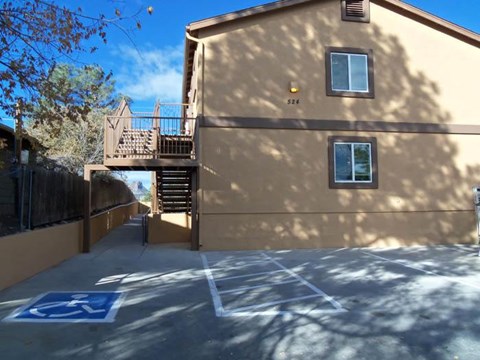 A building with a ramp leading to the entrance.