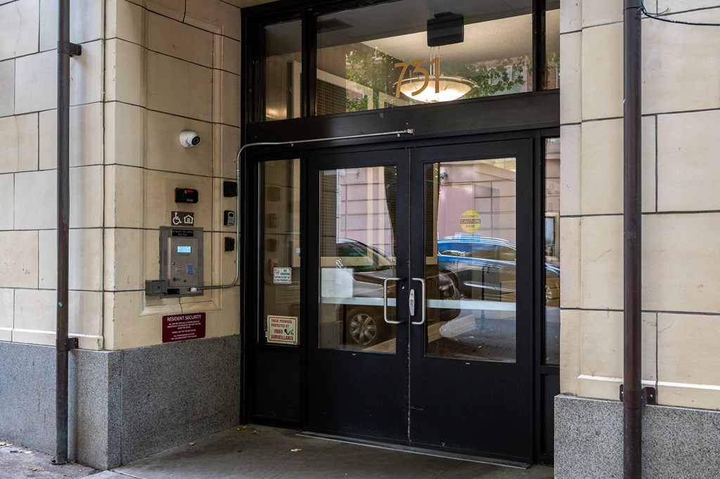 the entrance to a building with a black revolving door