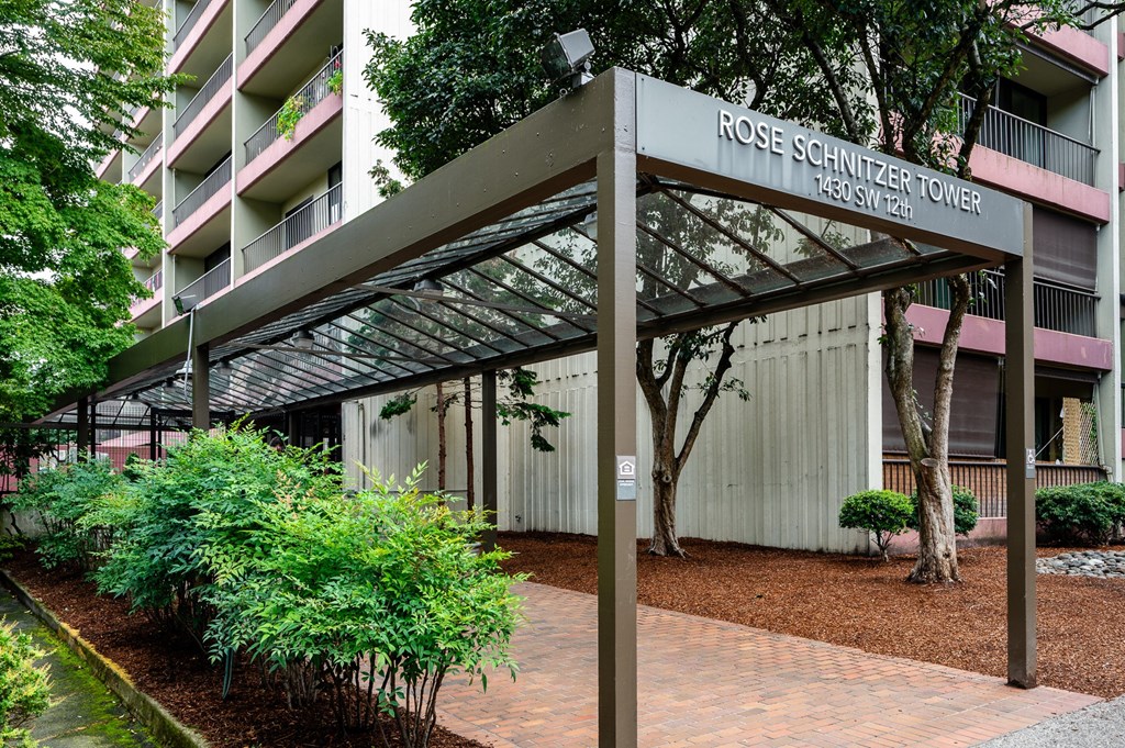 an exterior view of the rosemary tower condominiums in front of a building