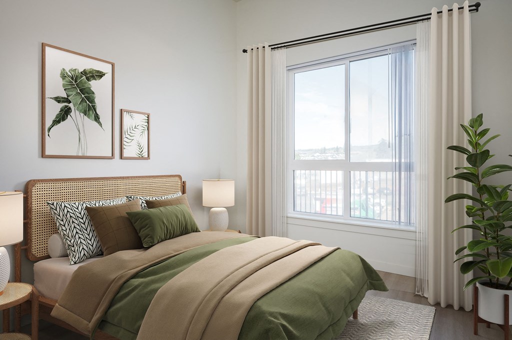 A bedroom with a bed, two lamps, a potted plant, and two framed pictures on the wall.