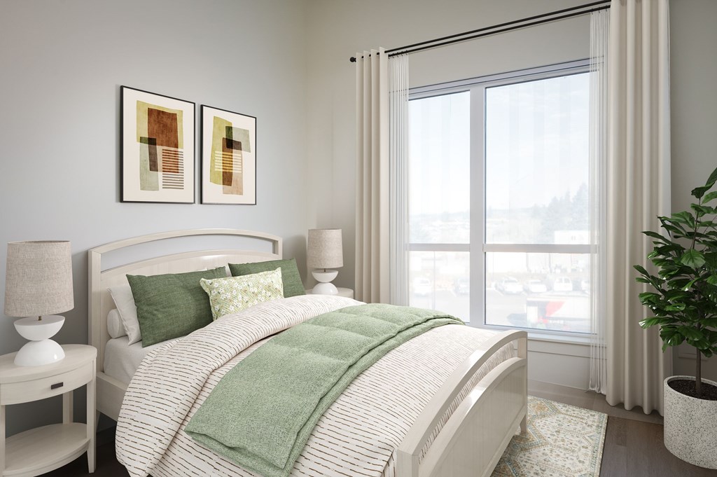 A bedroom with a large bed and two framed pictures on the wall.