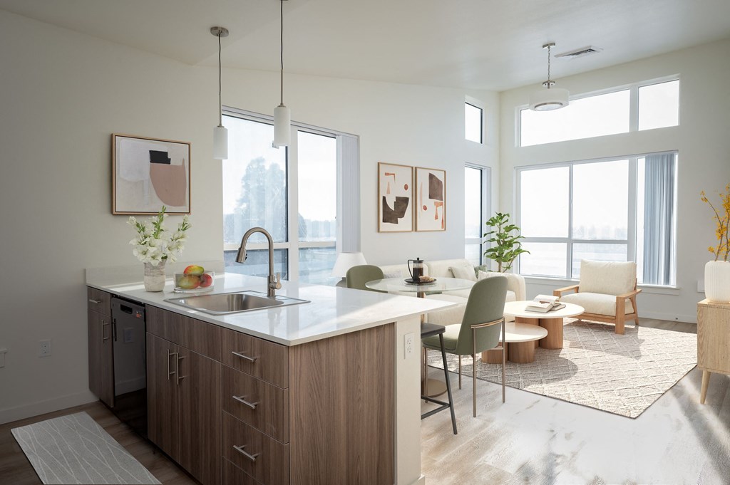 A modern kitchen with a dining table and chairs.