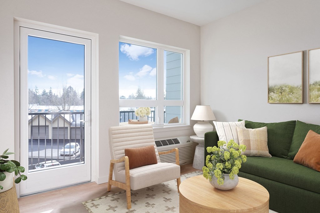 a living room with a green couch and white chair