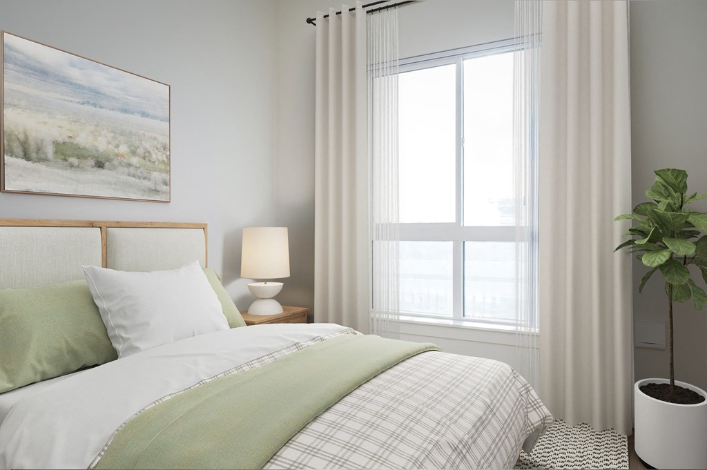 A bedroom with a bed, a lamp, a plant, and a painting on the wall.