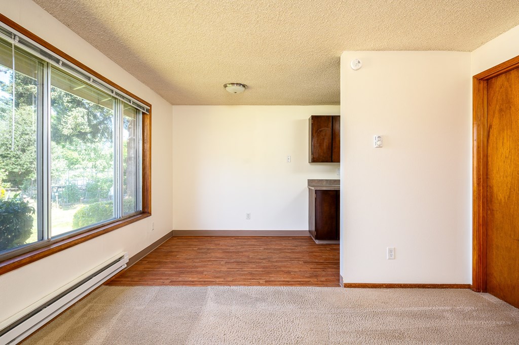 A room with a window and a door.
