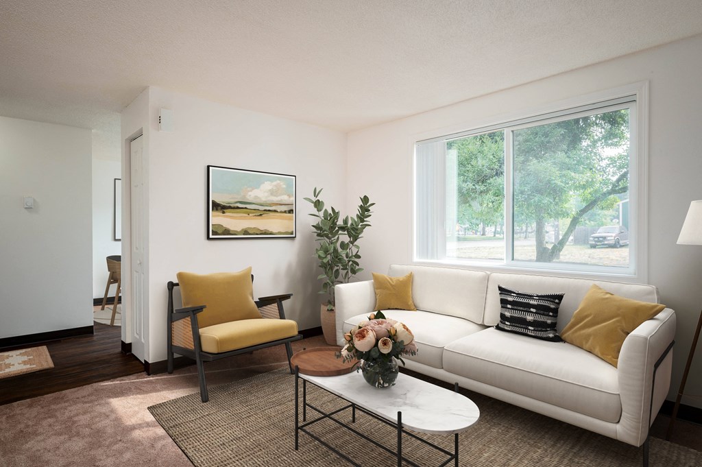 a living room with a white couch and a coffee table