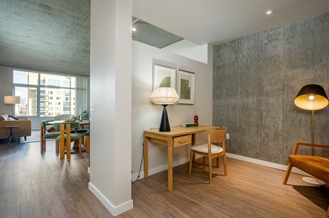 A room with a table and chairs in it.
