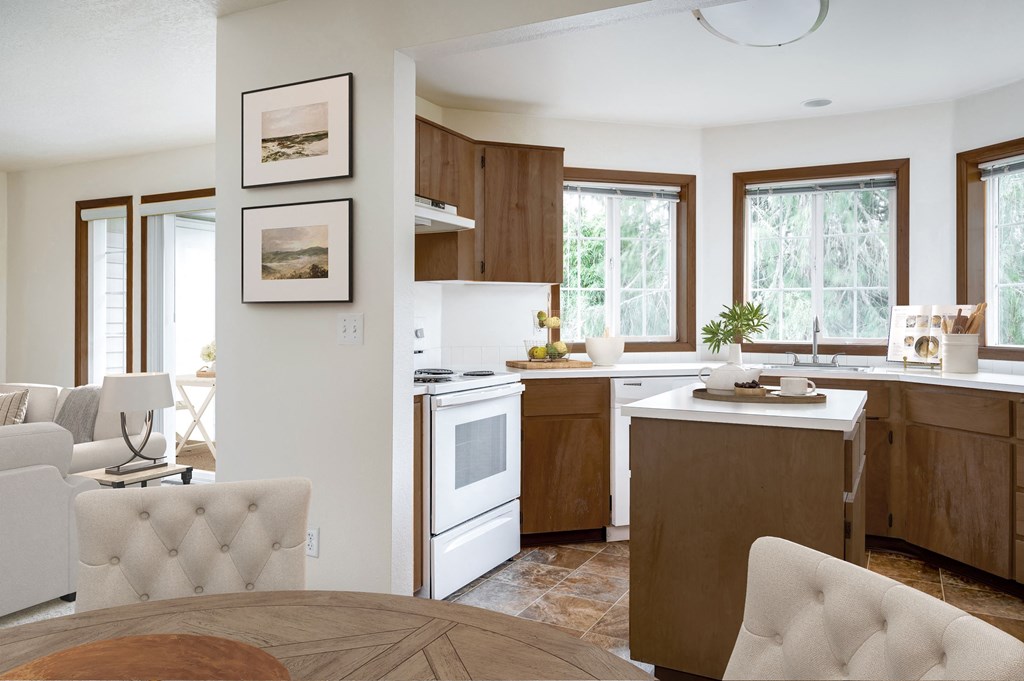 a kitchen with white appliances and wooden cabinets