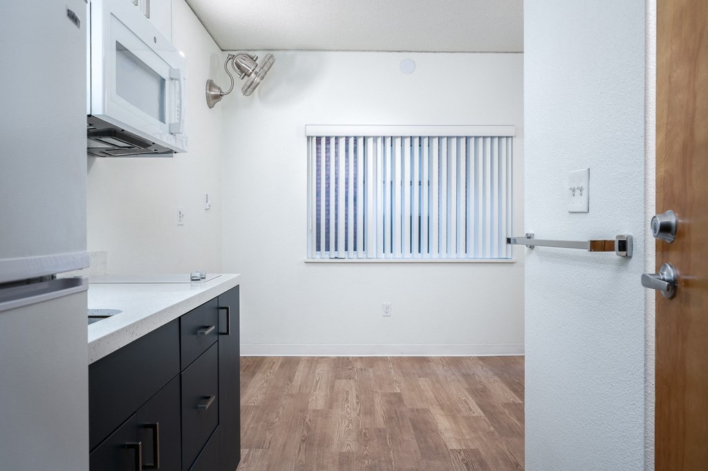 a kitchen and dining area in a 555 waverly unit