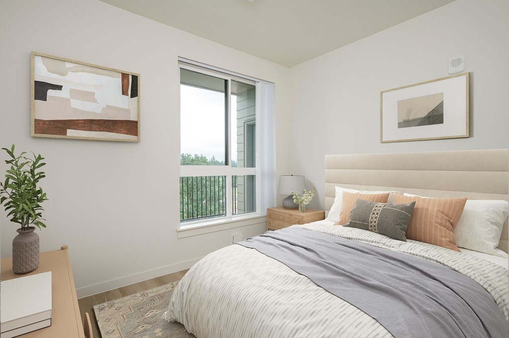 A bedroom with a large bed and a painting on the wall.