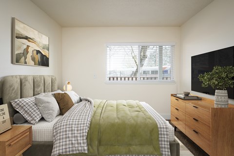 A bedroom with a bed, nightstand, and a painting on the wall.