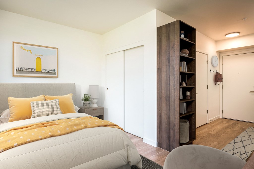 a bedroom with a bed and a closet