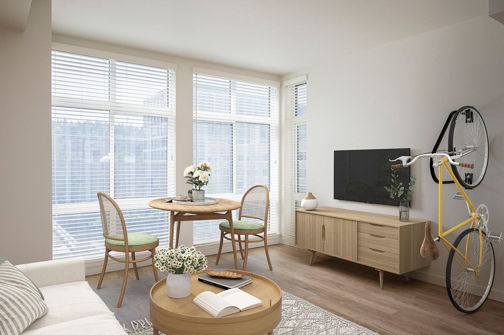 a living room with a couch and a table and a yellow bike