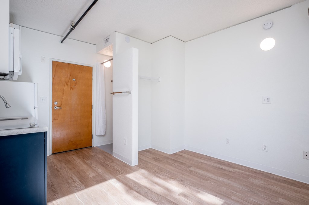 a kitchen and living room in a small apartment