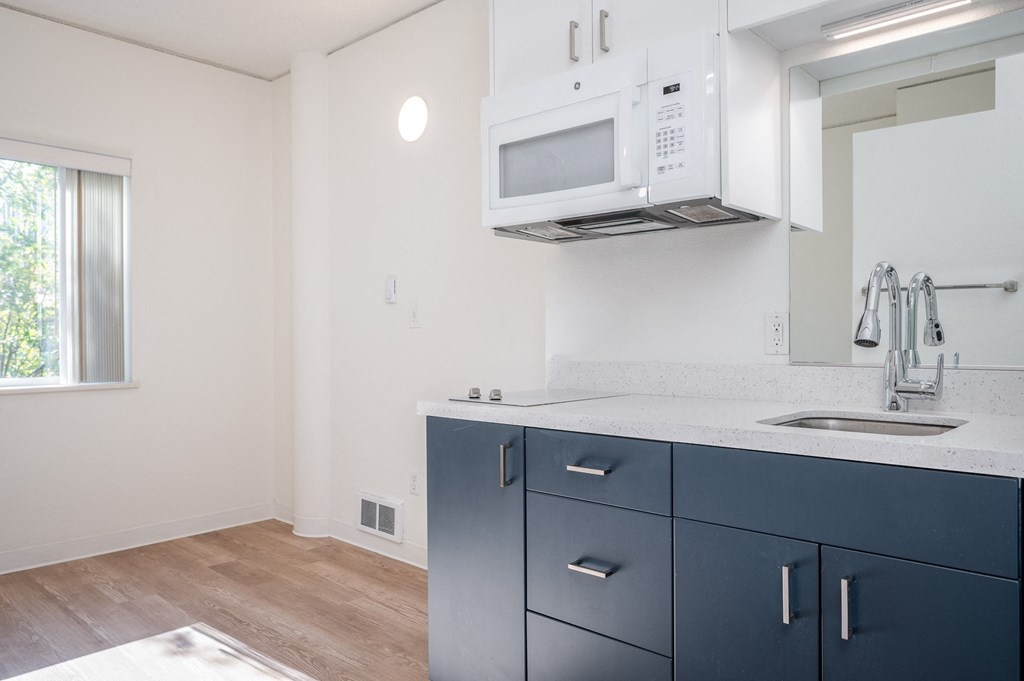 a kitchen and dining area in a 555 waverly unit