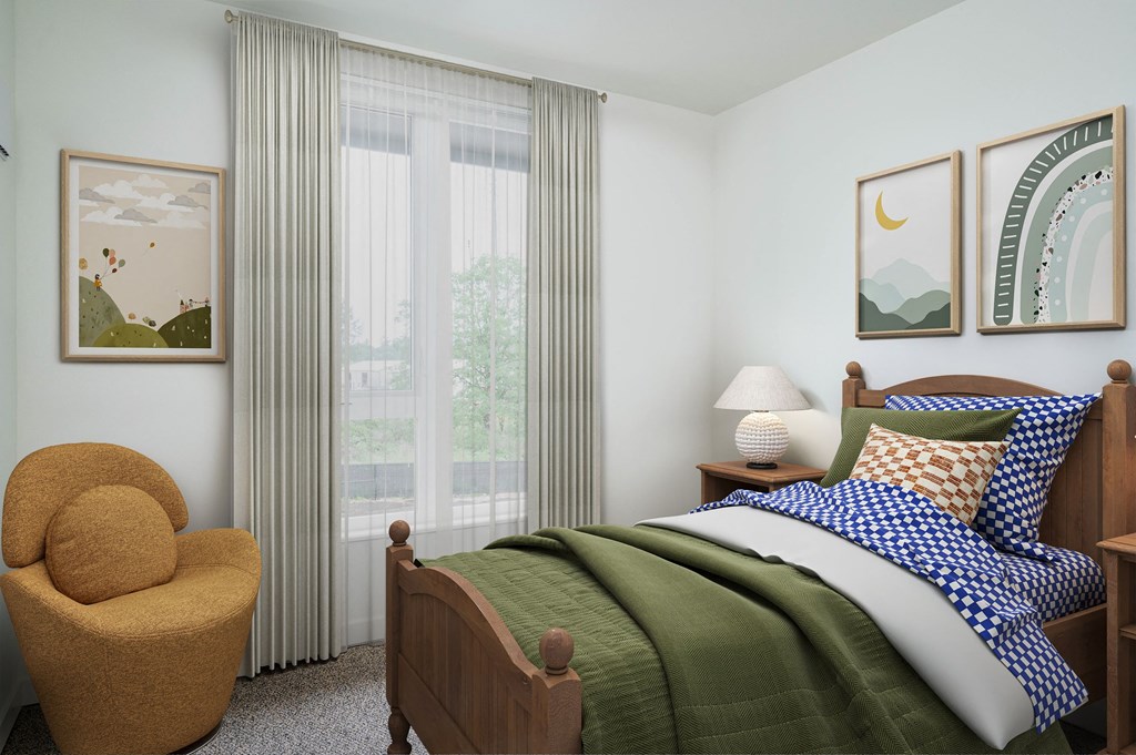 a bedroom with a bed and a chair in a 555 waverly unit