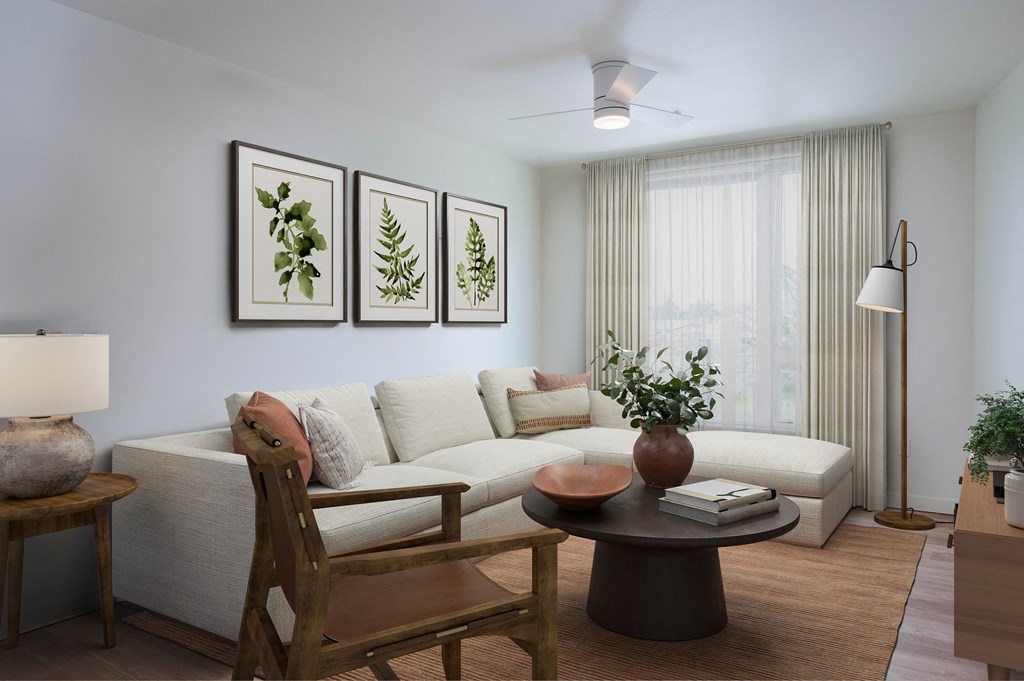 a living room filled with furniture and a large window