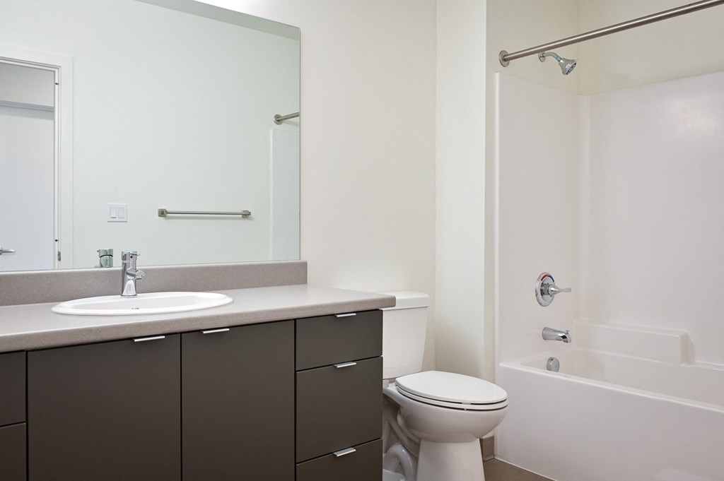a bathroom with a sink toilet and bathtub