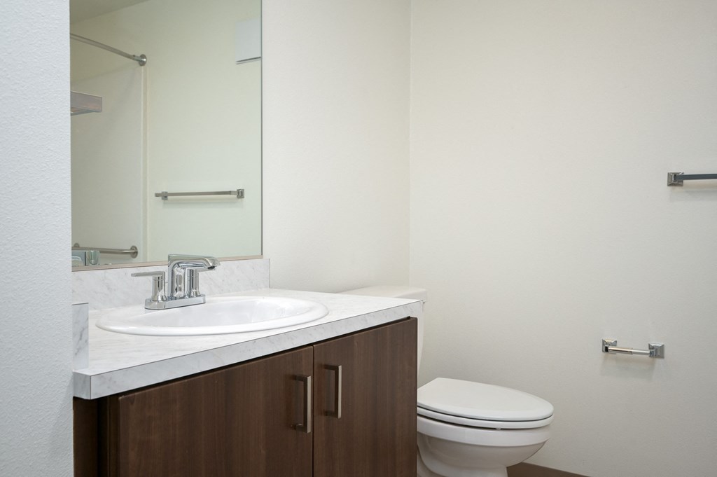 an empty bathroom with a toilet and a sink