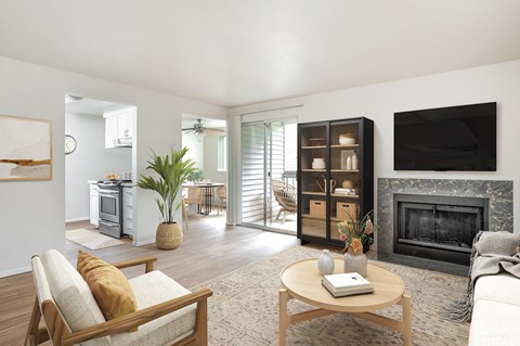 a living room with a fireplace and a television
