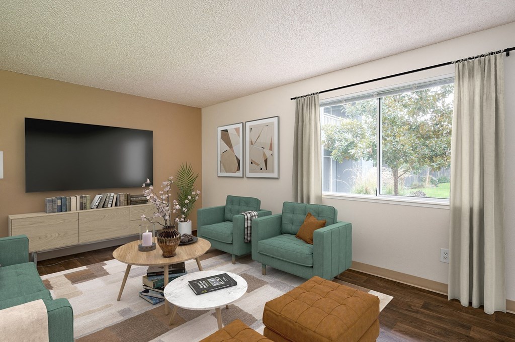 a living room with couches and a table and a television