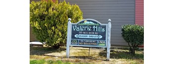 a sign in front of a house