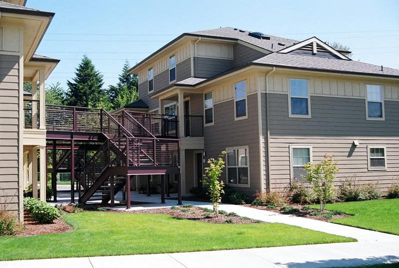 a house with a deck on the side of it