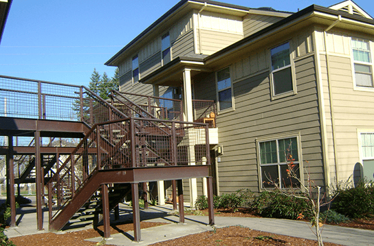 the back of the house has a ramp to the deck