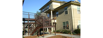 the back of the house has a ramp to the deck