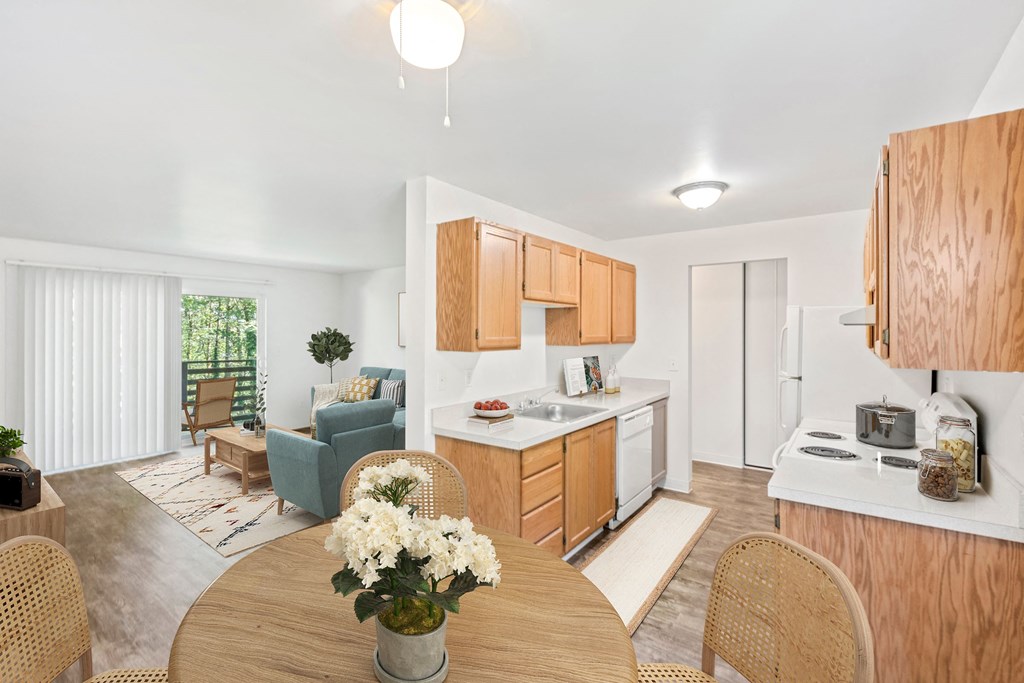 a kitchen and dining room with a table and chairs
