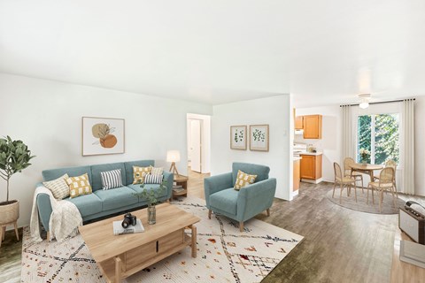 a living room with a blue couch and a coffee table
